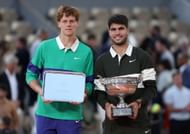 Jannik Sinner (left) and Carlos Alcaraz (right) with the men's singles runner-up and winner's trophies respectively at the 2025 French Open (Source: Getty)